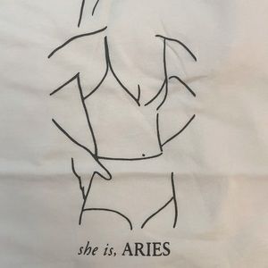 She is Aries Tshirt. NWT. Medium